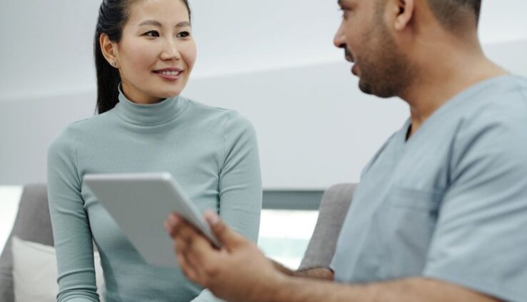 Woman talking with a doctor during a clinic consultation